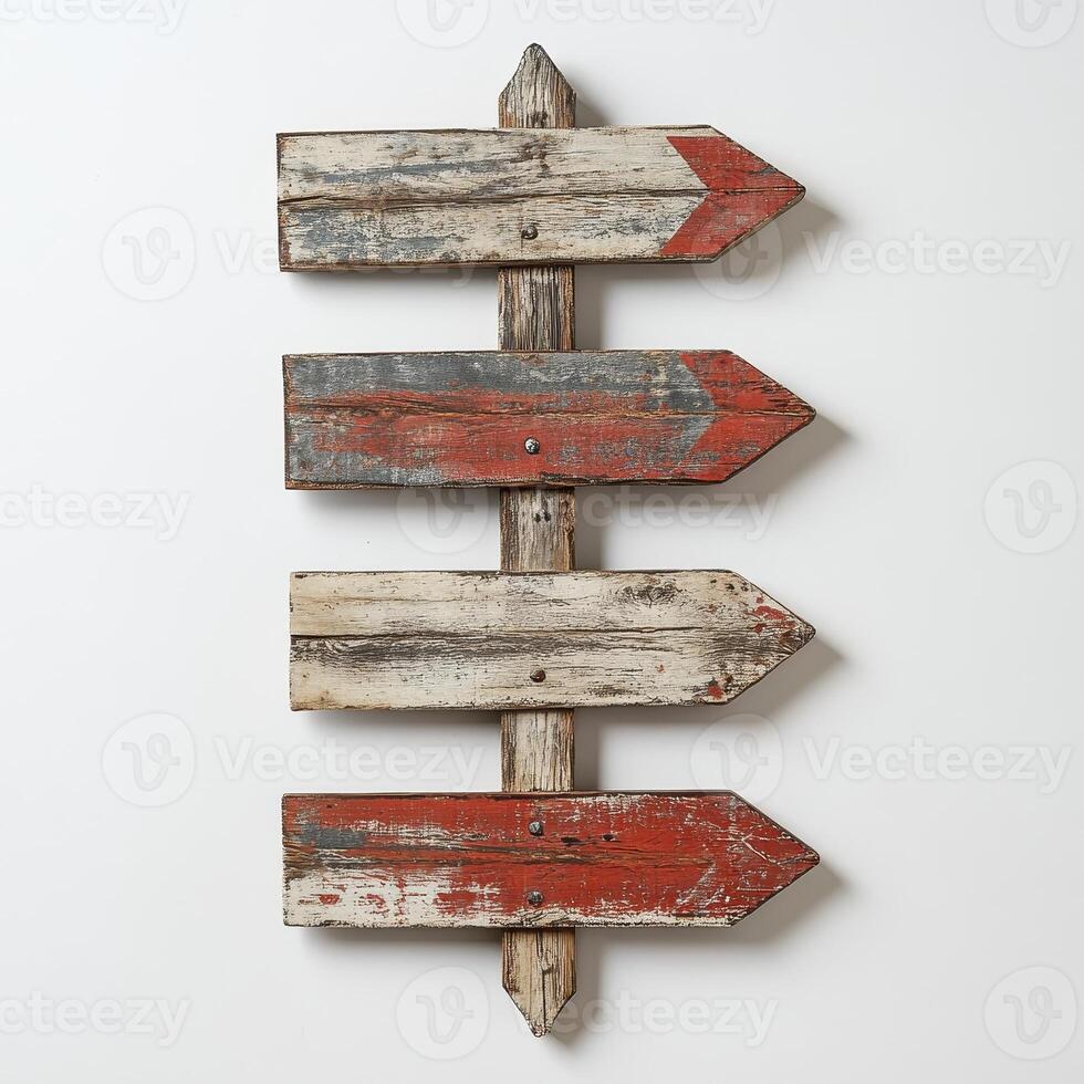 A rustic wooden signpost with four arrows, suggesting direction or choices photo