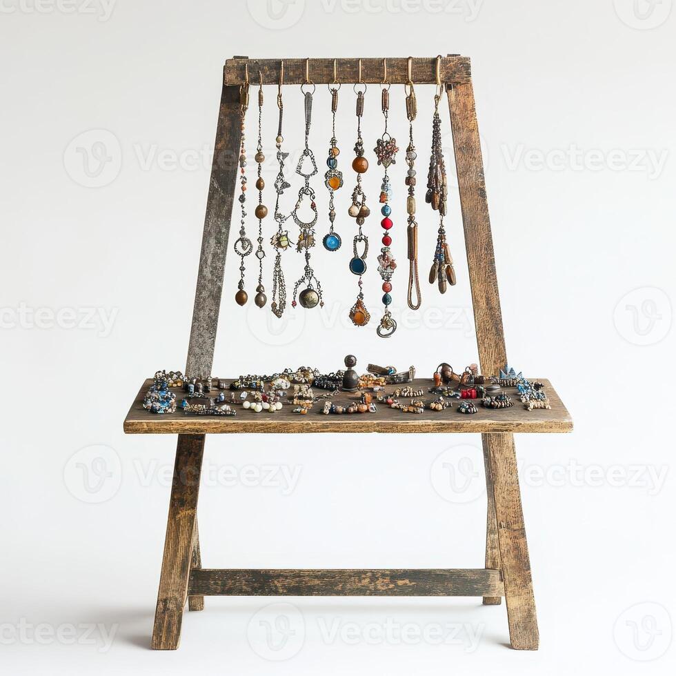 Display of various jewelry pieces arranged on a wooden stand for showcasing and sale photo