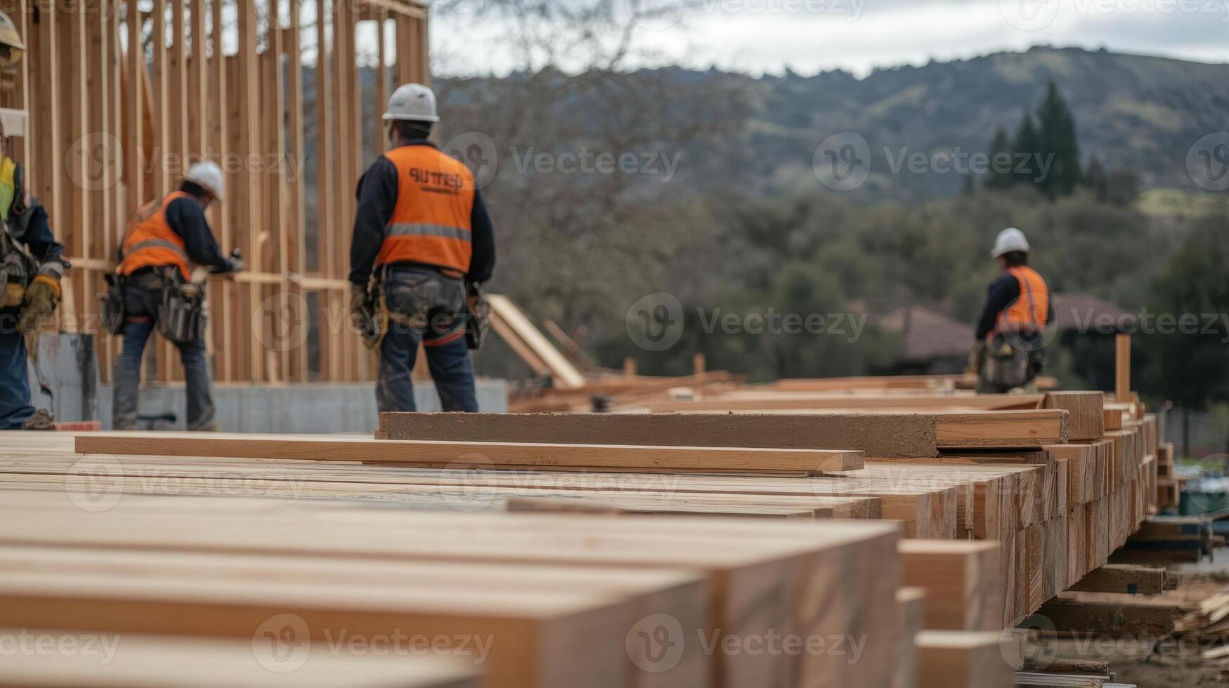 Construction workers in safety gear on a building site with wooden beams photo