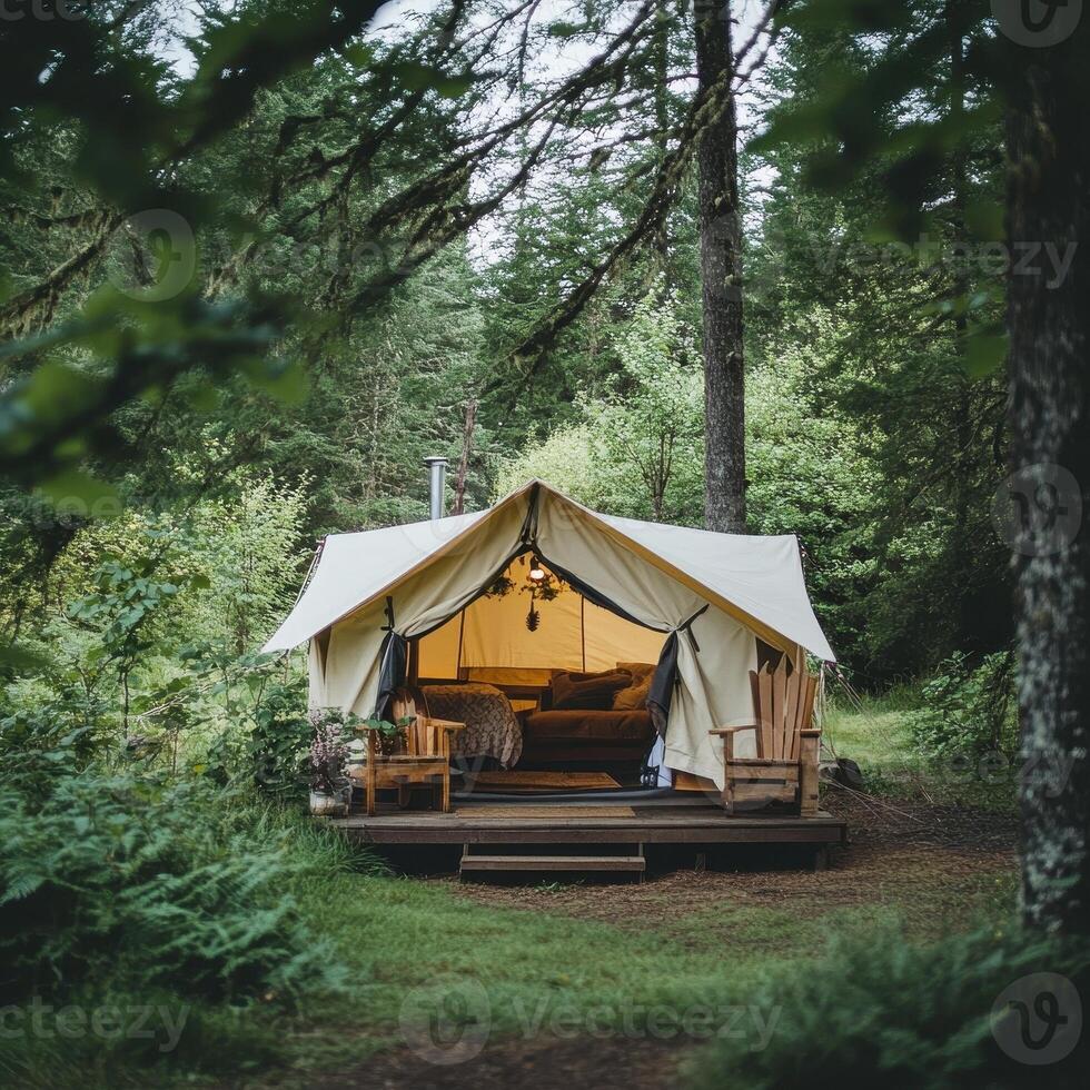 A cozy glamping tent nestled in a lush forest, perfect for relaxation and nature immersion photo