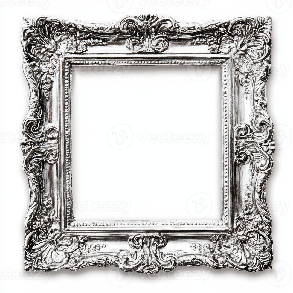 A decorative, ornate silver picture frame with intricate designs and no image inside. photo