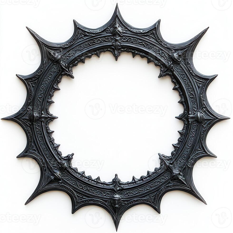 A decorative, spiked black circular frame with intricate designs photo
