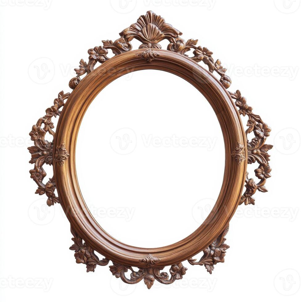 Ornate vintage mirror frame with intricate floral designs and an empty reflection space. photo