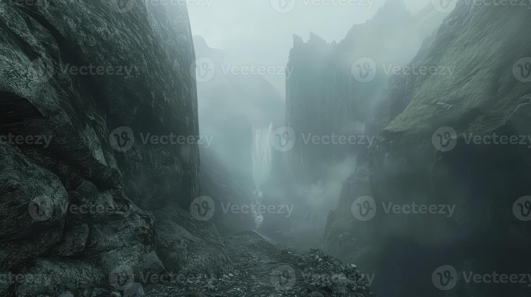 A misty landscape featuring a waterfall surrounded by towering cliffs and fog photo