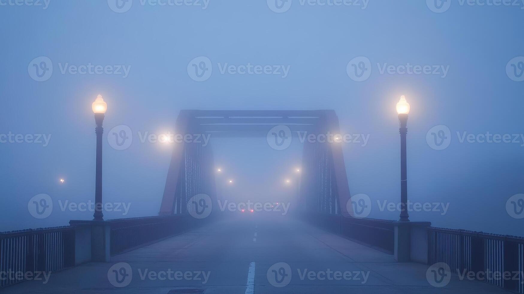 A foggy bridge illuminated by streetlights, creating a mysterious atmosphere. photo