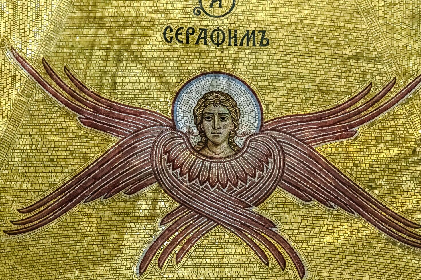 An image of an angel with wings on a gold background photo