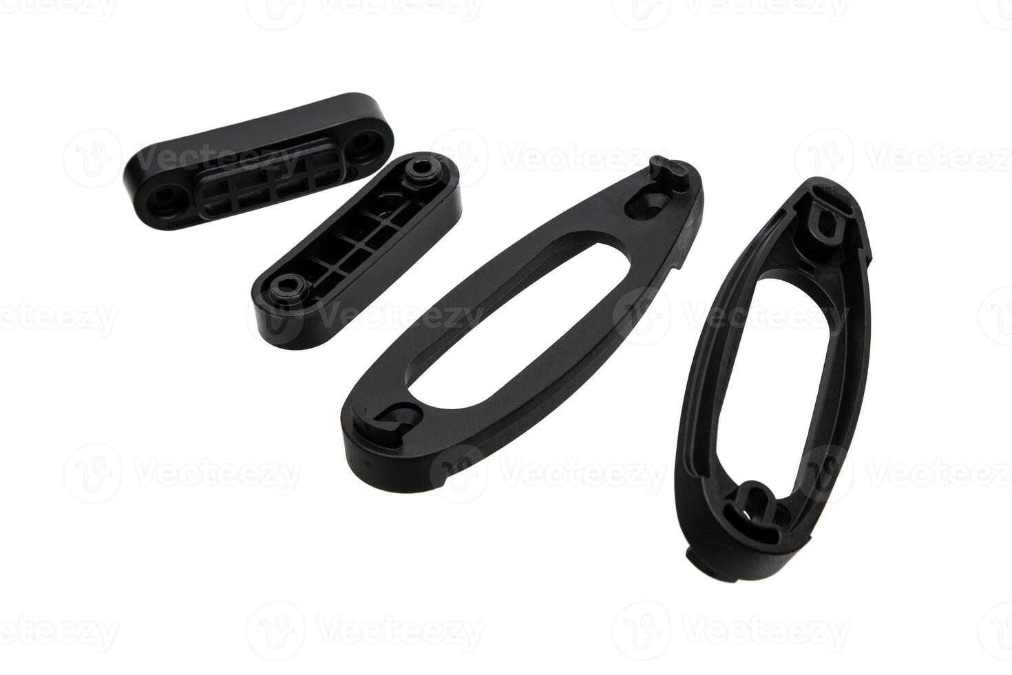 Black plastic spacers designed for extending the stock of rifles or shotguns, isolated on a white background. photo
