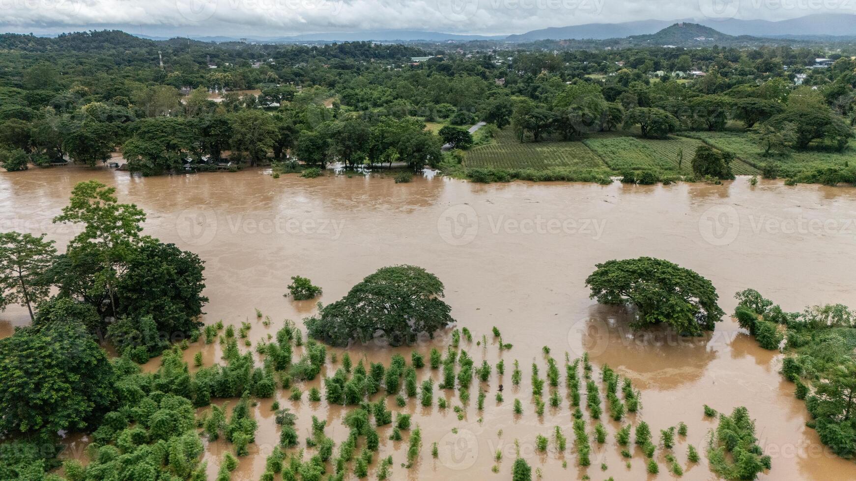 Aerial view of Mae Kok river rising and flooding rural area in Chiang Rai province of Thailand. photo