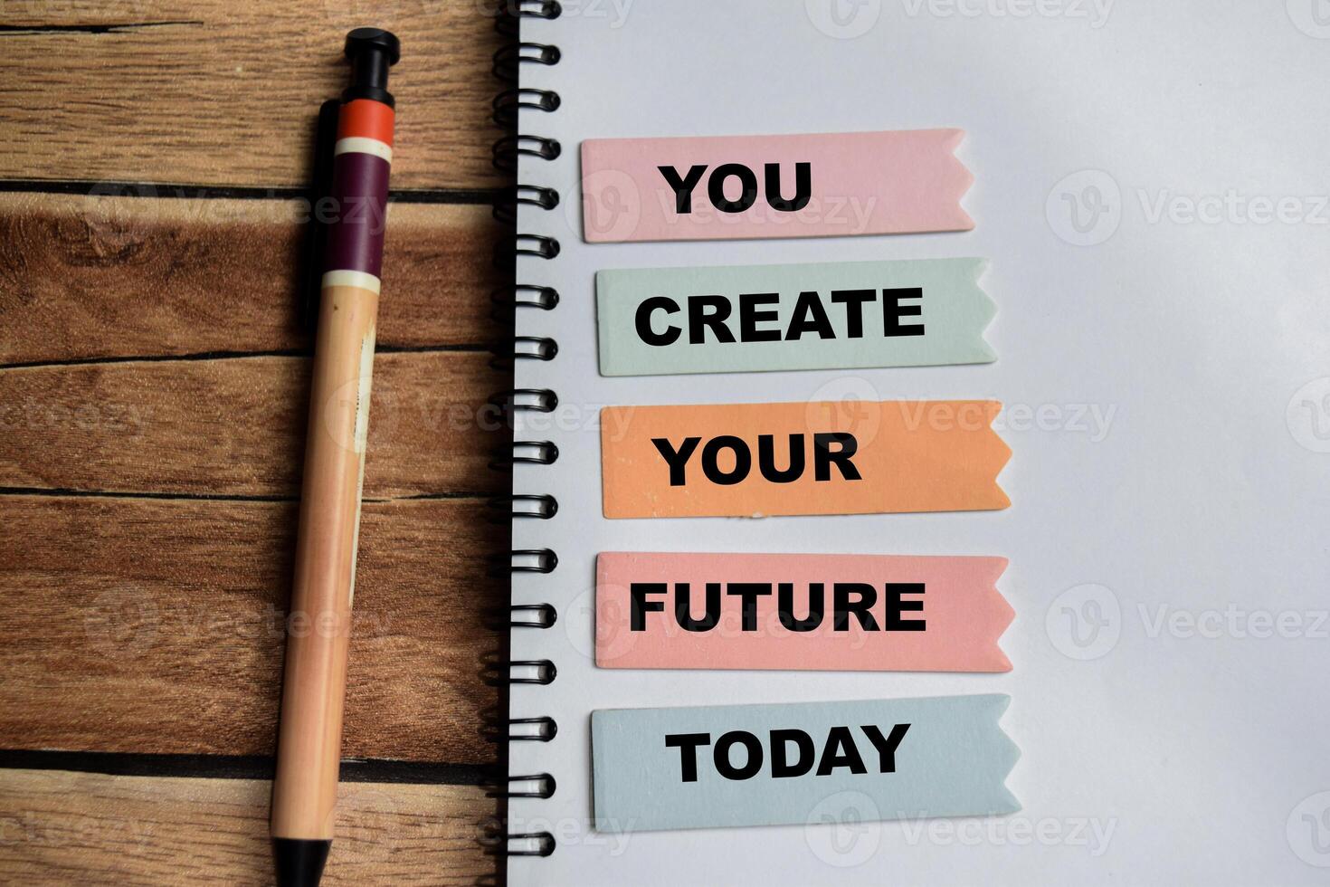 Concept of You Create Your Future Today write on sticky notes isolated on Wooden Table. photo