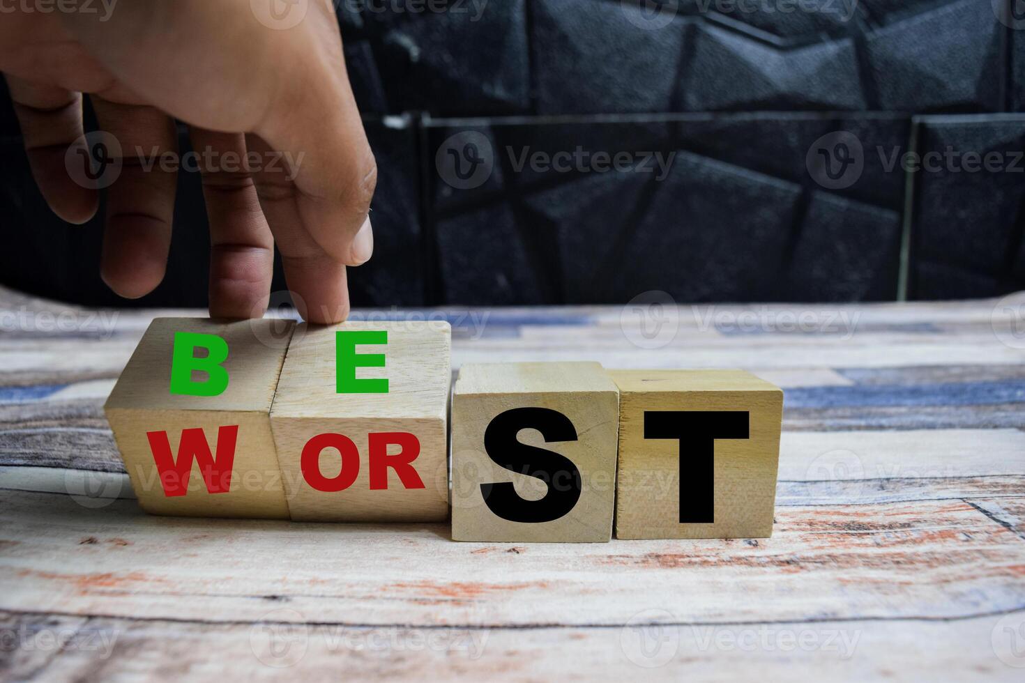 Concept word Best or worst, changes thw eord best to worst on wooden blocks on a wooden table photo