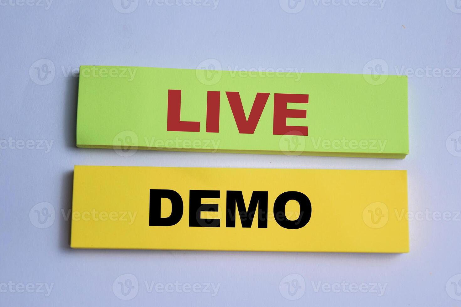 Concept of Live Demo write on sticky notes isolated on Wooden Table. photo