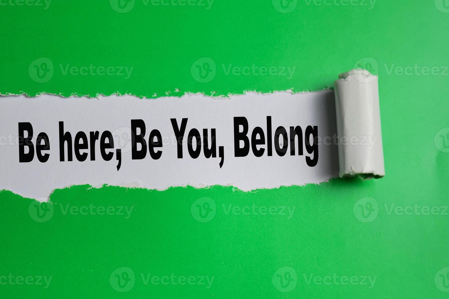 The Be here, Be You, Belong Text written in torn paper photo