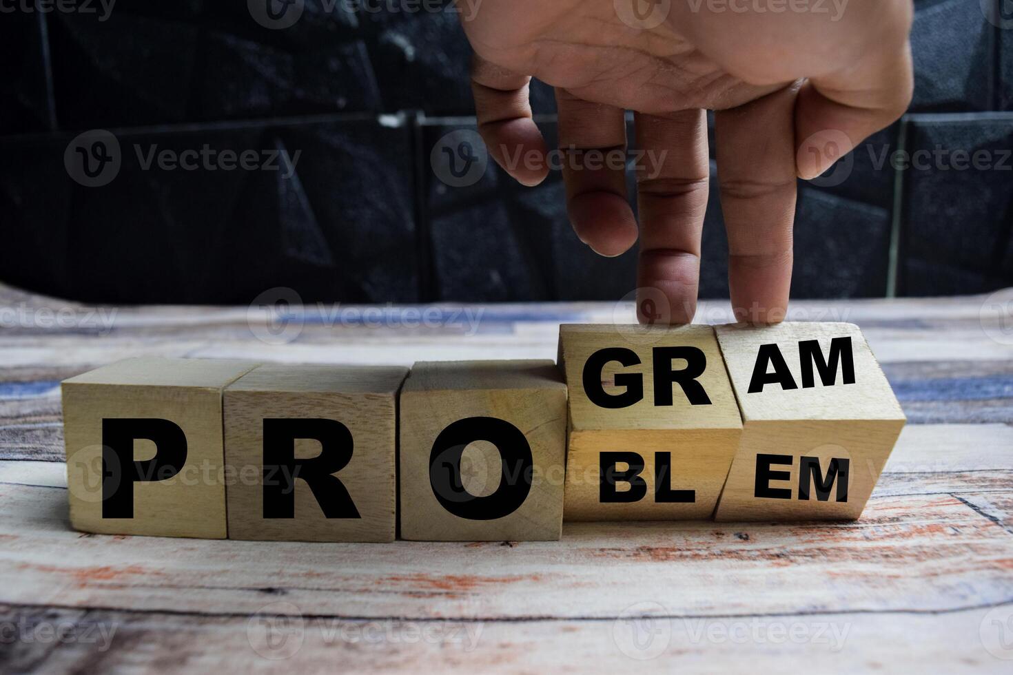Concept word Solving a problem and making program and changes the word problem to program on wooden blocks on a wooden table photo