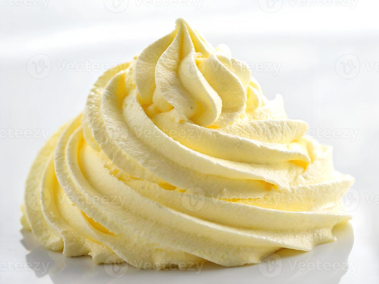 A close up of a white waffle cone with whipped cream photo