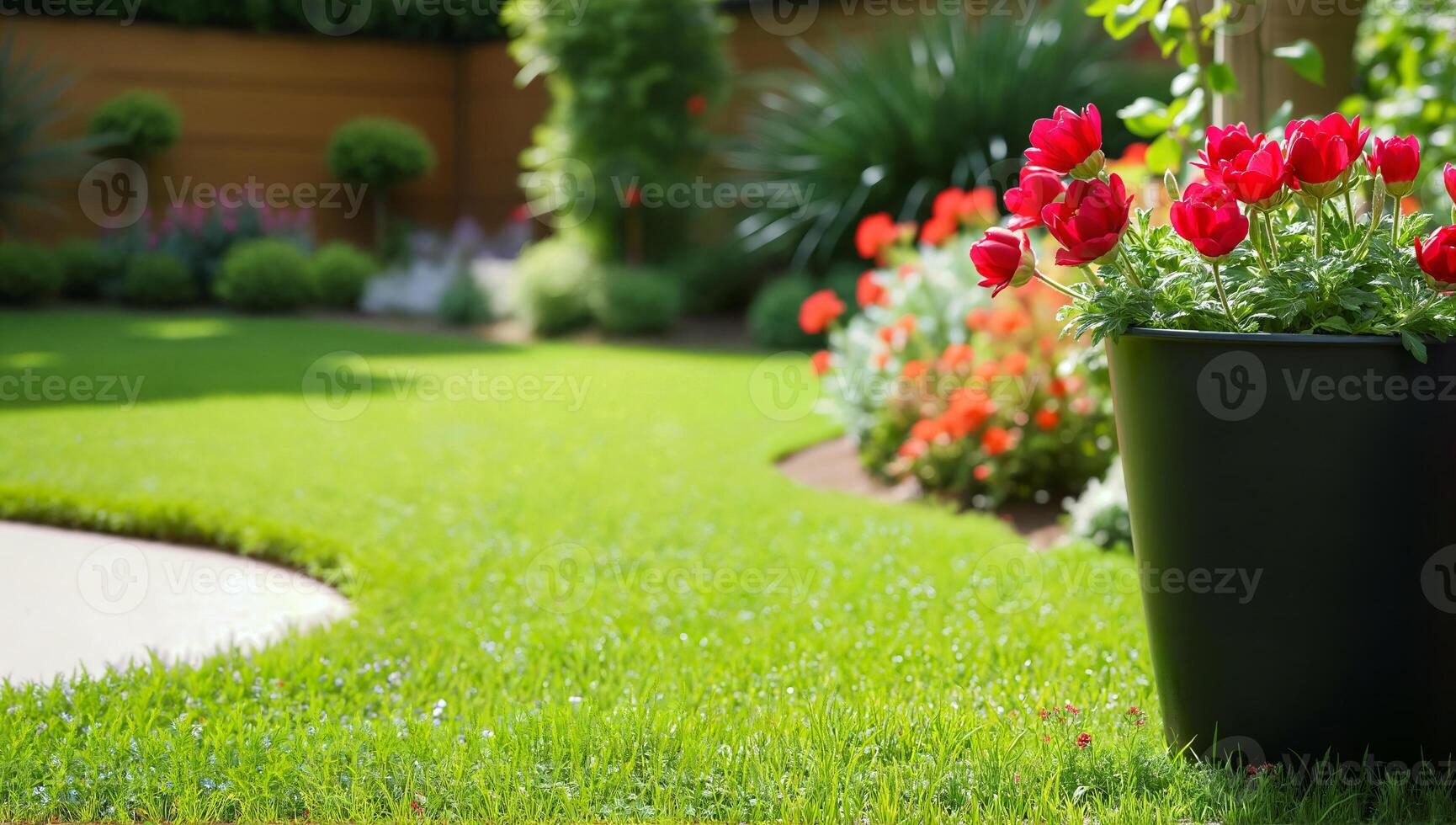 Vibrant Flower Pot and Lush Green Lawn in a Beautiful Garden Setting photo