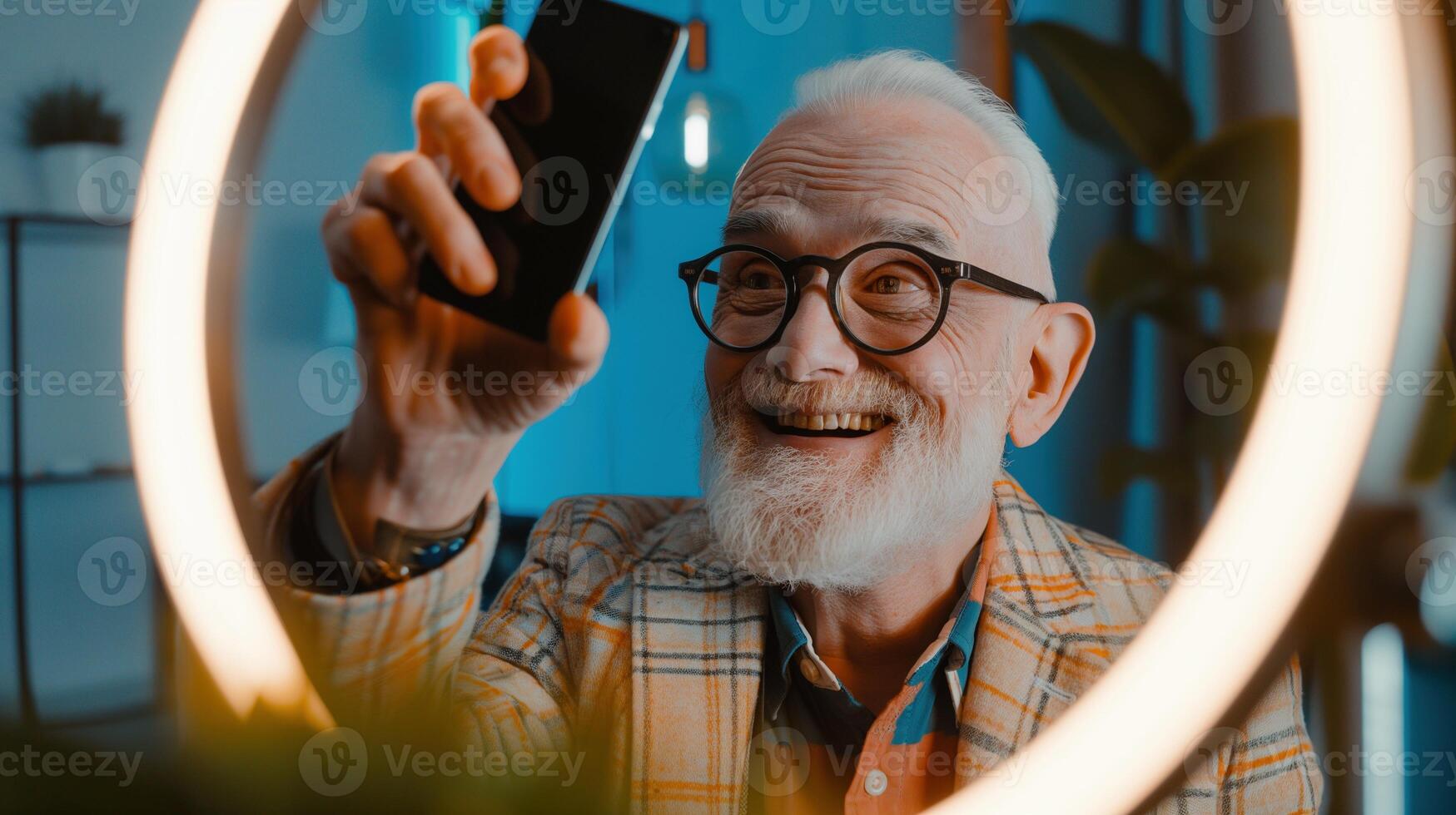 Elderly man using smartphone for social media content portrait image. Joyful senior guy in glasses, with mobile phone photography human scene. Content creator concept photo-realistic photo