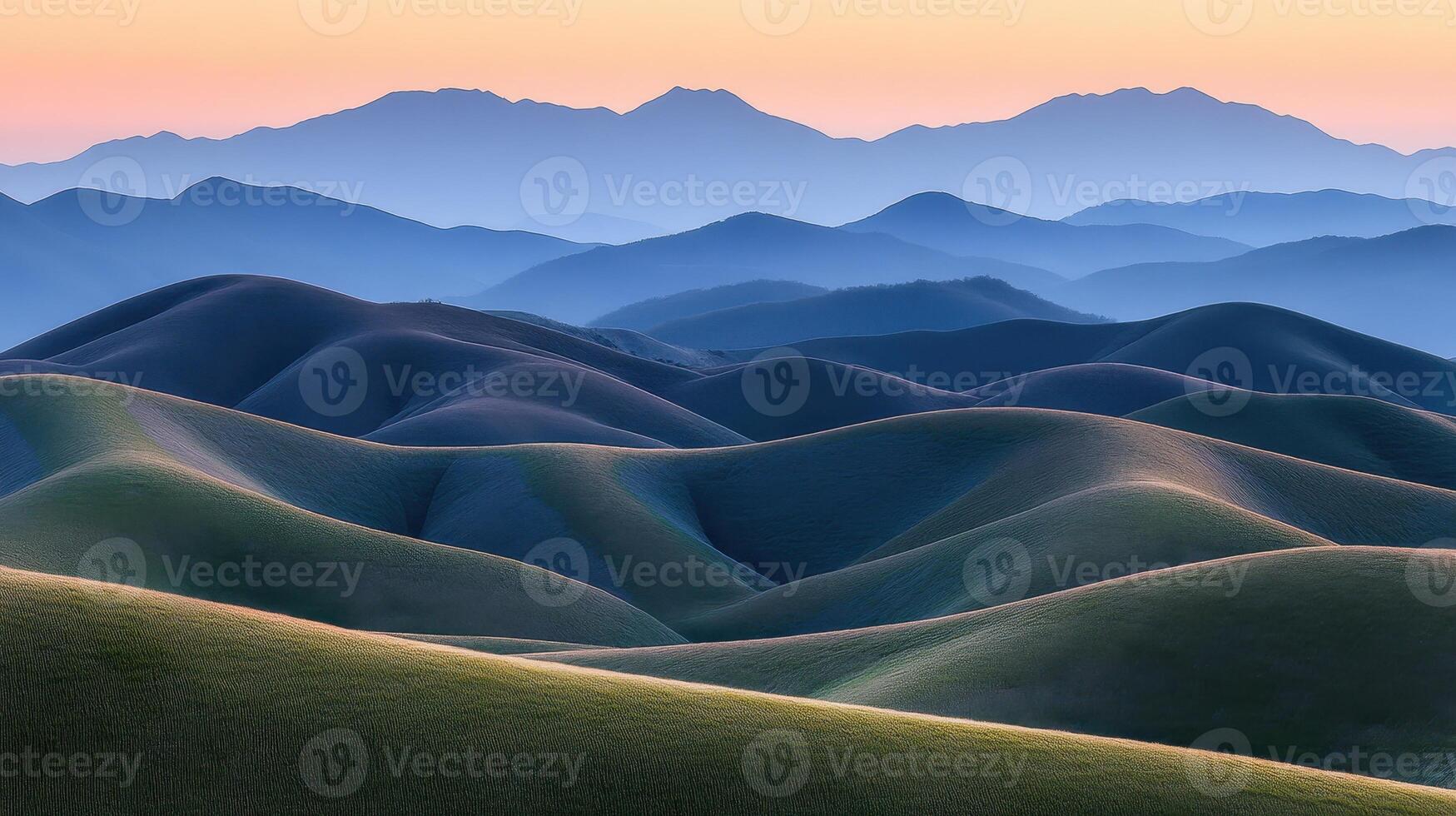 Rolling Hills Underneath Distant Mountain Ranges photo