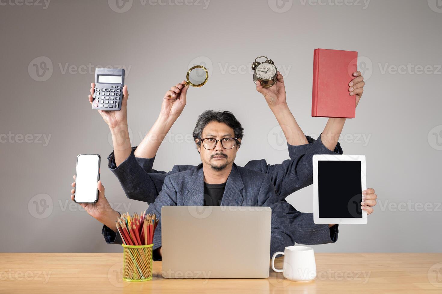 In business you need to be prepared for anything. Serious businessman working on laptop. photo