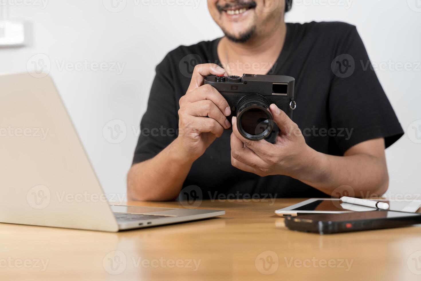 Camera and several camera lens on coffee table. Happy retirement life, hobbies and interests for the elderly concept. photo