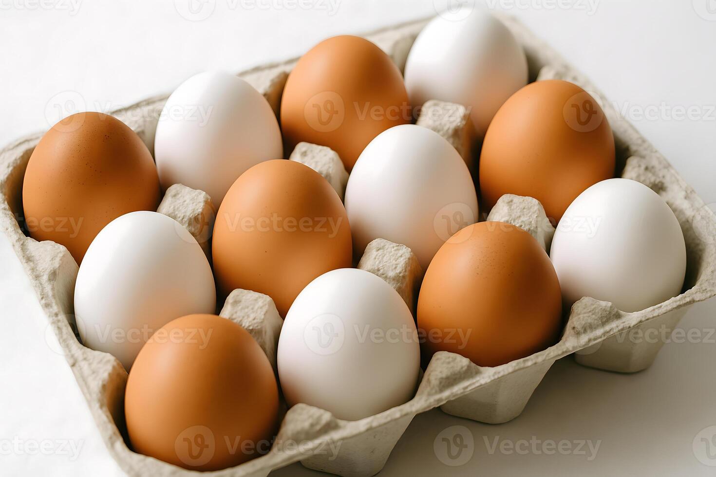 Carton of fresh brown and white eggs on white background, natural source of protein for cooking, baking, and healthy meals photo