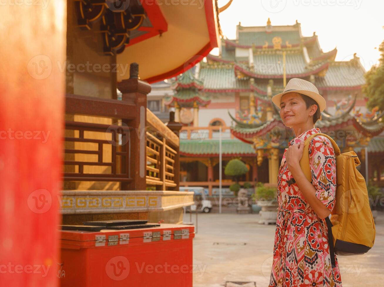 asian Woman in dress Exploring Colorful Streets Near Buddhist Temples in Bangkok photo