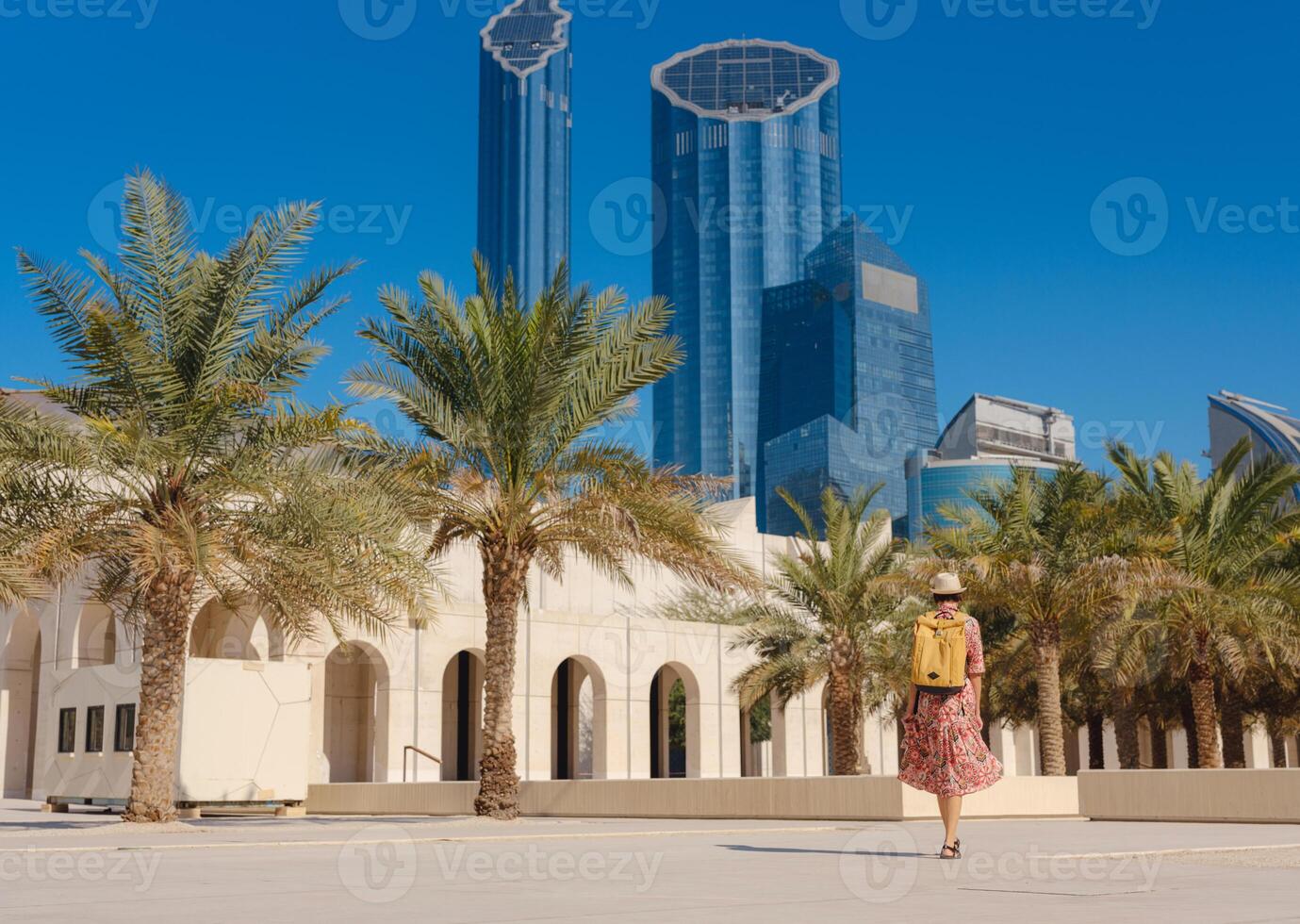 woman exploring Qasr Al Hosn Park in Abu Dhabi. Surrounded by lush greenery and historical landmarks, she enjoys the serene atmosphere and Emirati heritage in heart of Abudhabi. photo