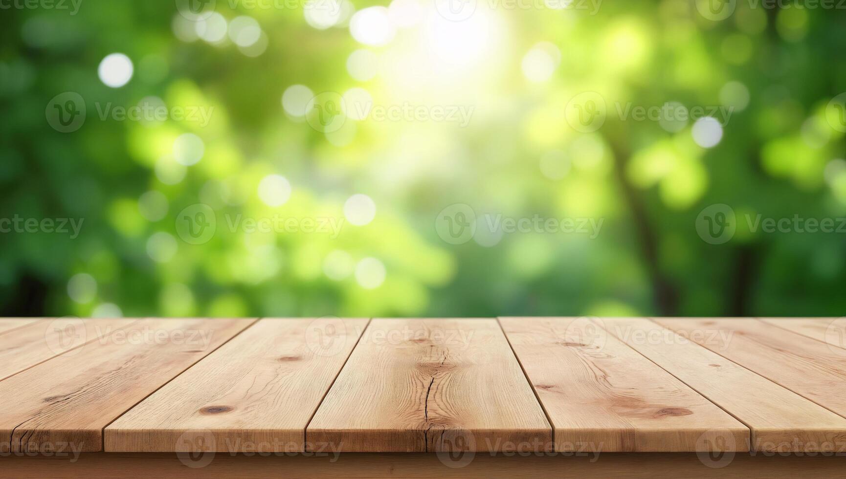 Natural Light Over Wooden Tabletop Surrounded by Greenery photo
