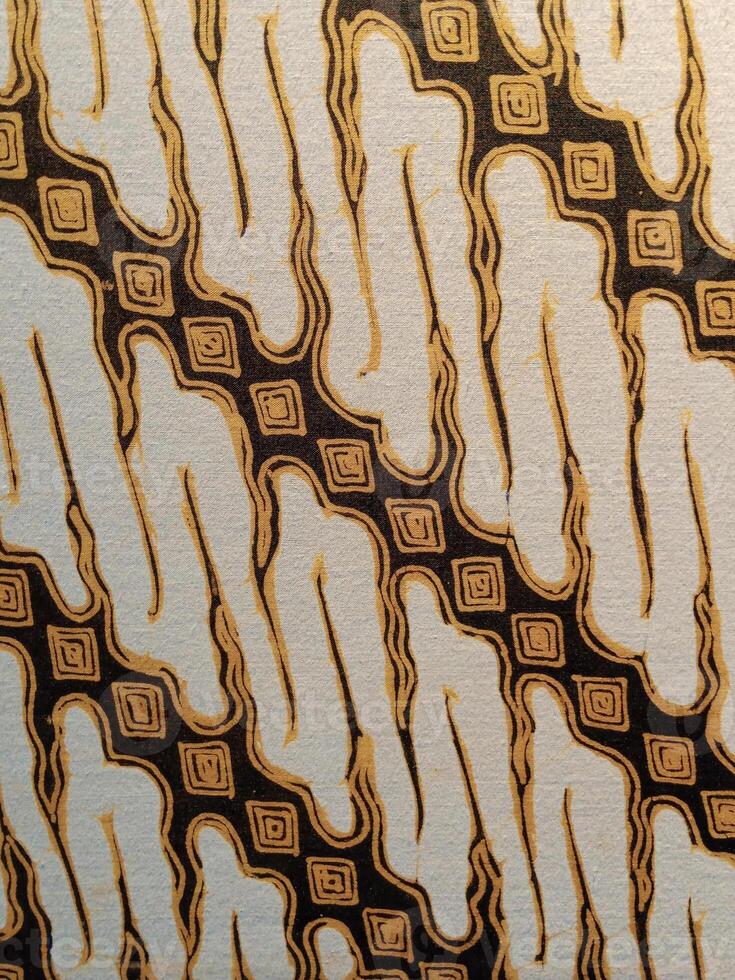 Batik pattern background. A close up of Javanese batik with a Parang Parung pattern. Indonesian batik, photo