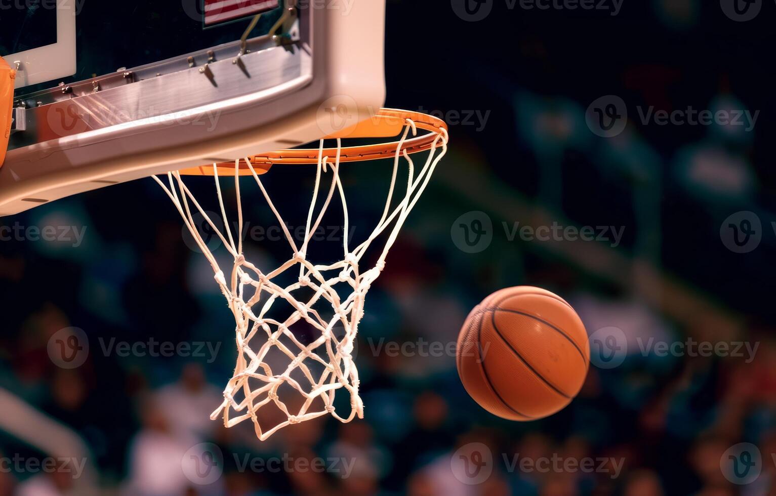 Basketball gracefully sails through the net, showcasing a perfect shot in a competitive atmosphere photo