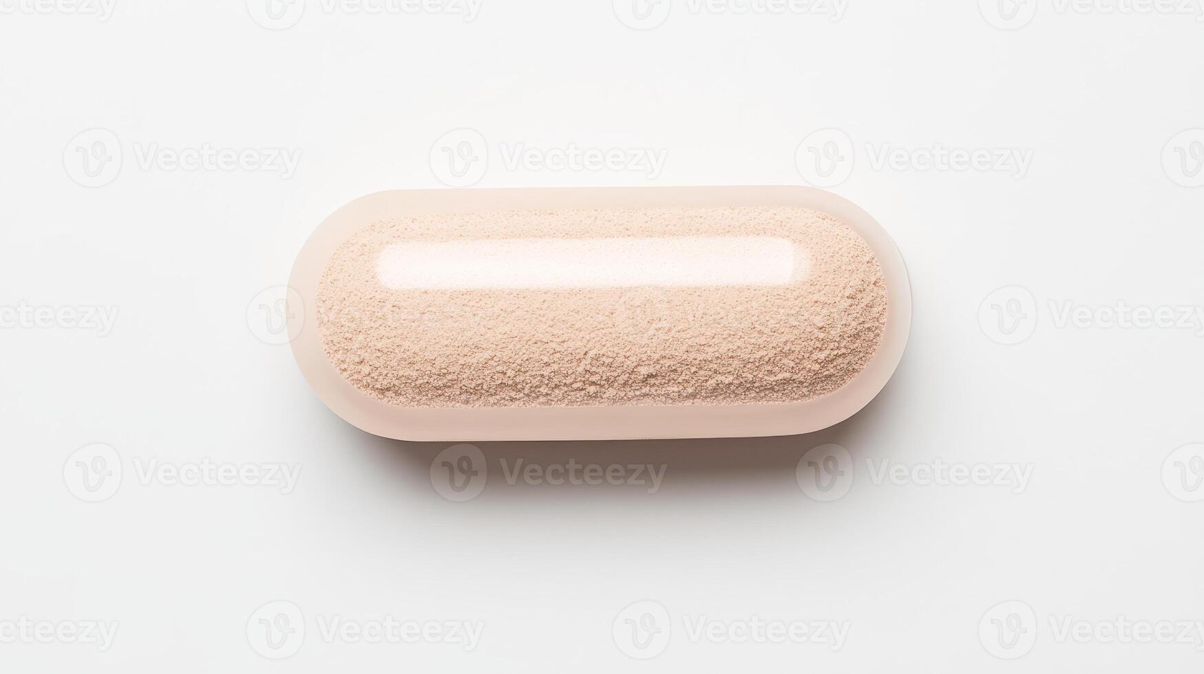 A small round pill on a white surface photo