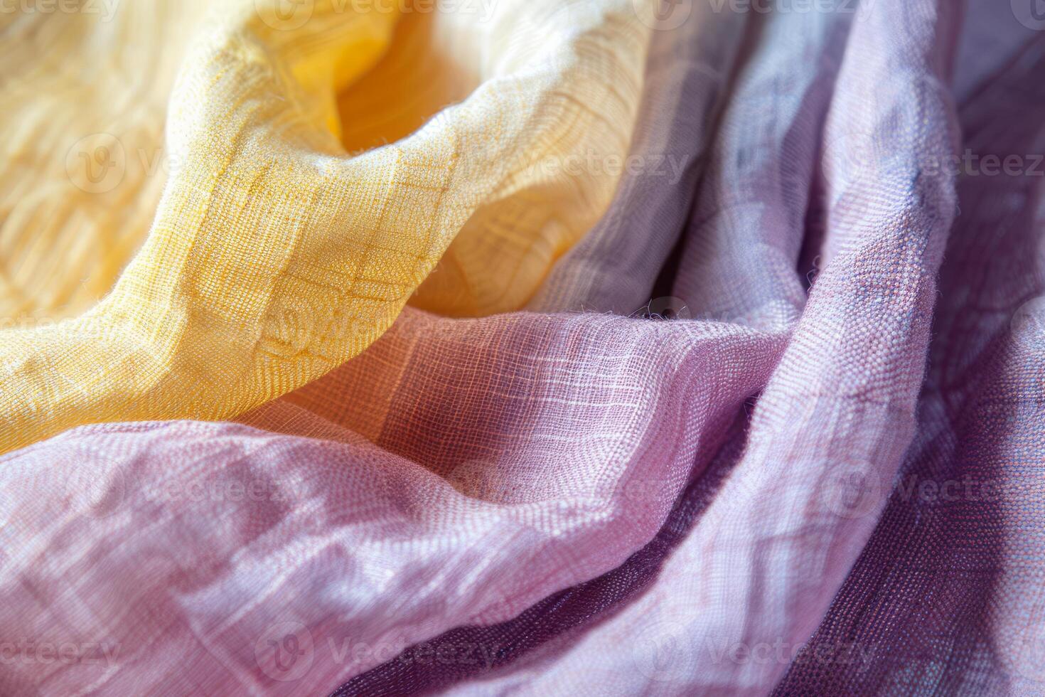 This close-up showcases the intricate textures and harmonious color palette of softly draped fabric, blending warm yellows with tranquil purples photo