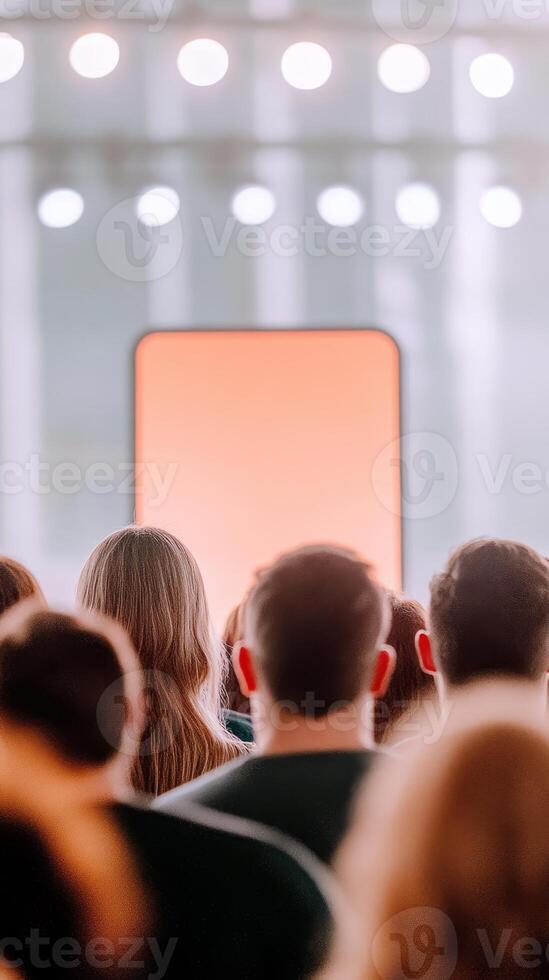 Audience attentively engages with a presentation on mobile app design focused on real estate solutions and user experience improvements photo
