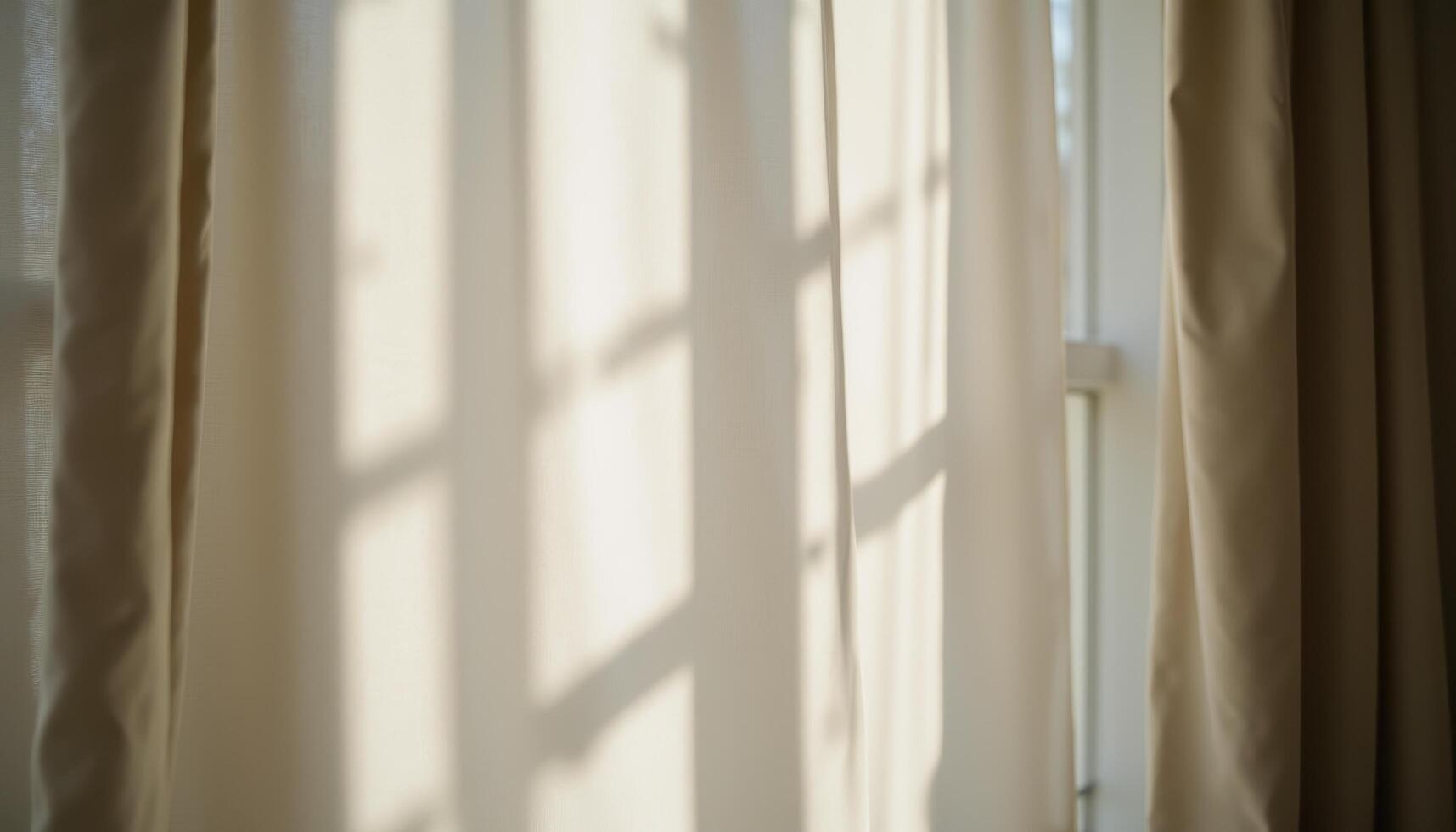 The play of light and shadow on a draped curtain, creating depth and movement. photo