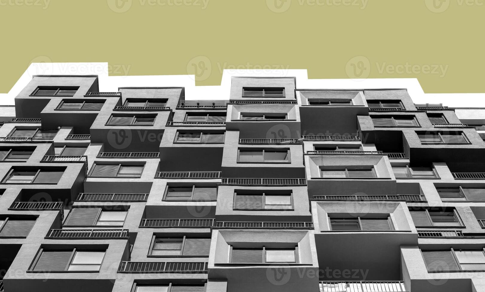 Building with gray exterior. Modern high rise multistorey condominium in developing downtown photo