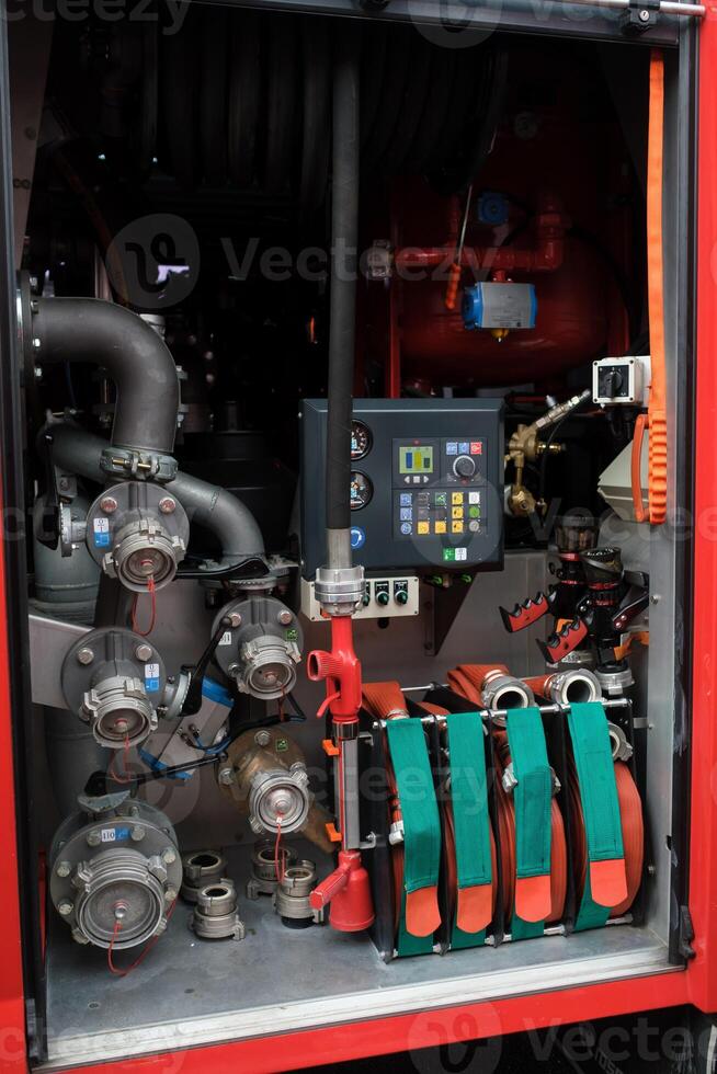 Detailed view of firefighting equipment in action during training exercises at a fire station in an urban area at midday photo