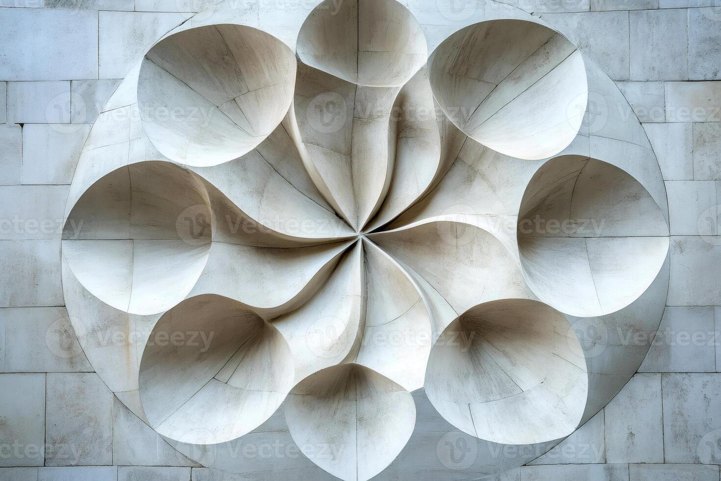 Modern stone relief creating concentric circles on building facade photo