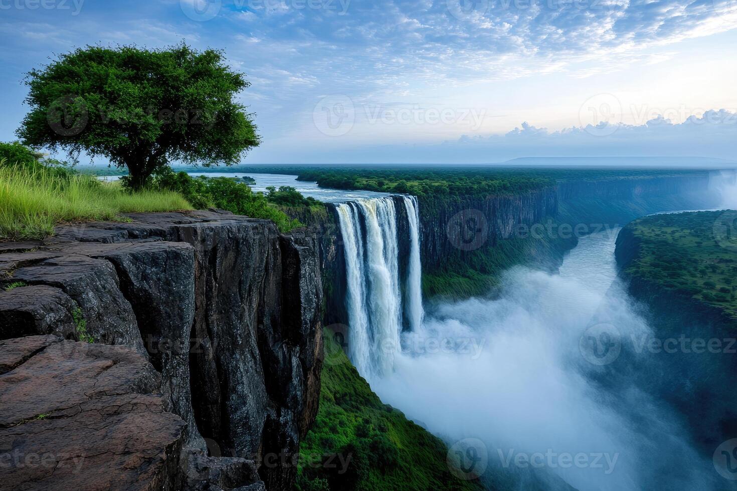 Victoria falls creating mist in the early morning light photo