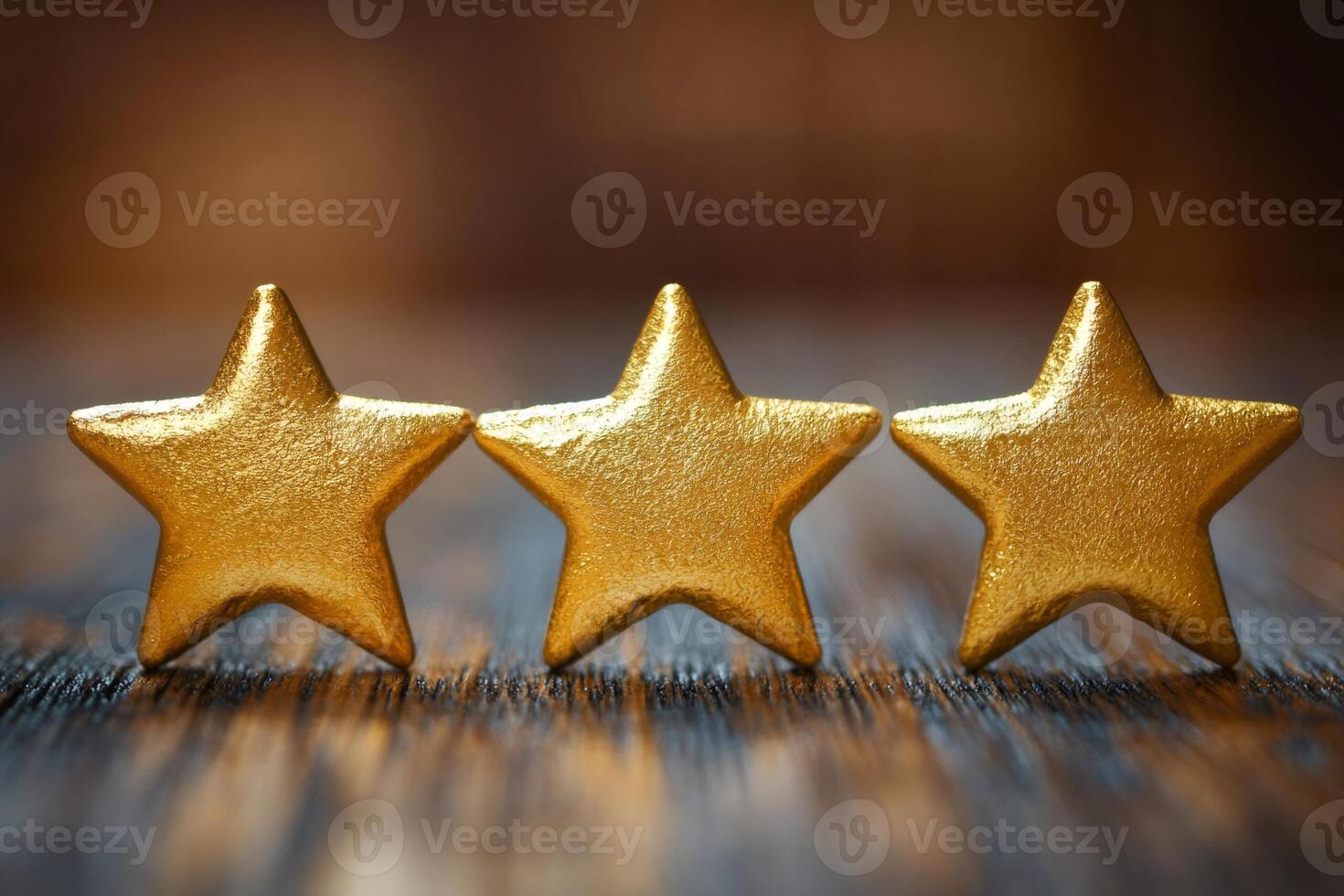 Three golden stars representing excellent customer service rating on wooden table photo