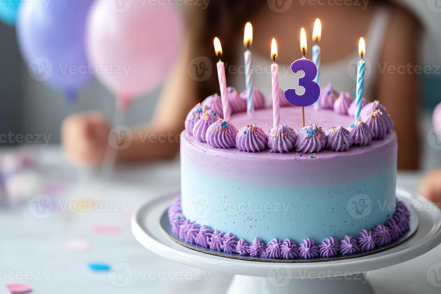 Delicious purple and blue birthday cake celebrating a third birthday party photo