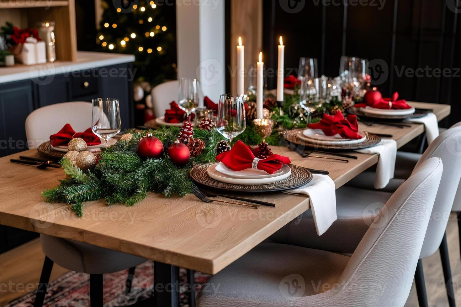 Christmas table setting decorated with candles, garland, and ornaments photo