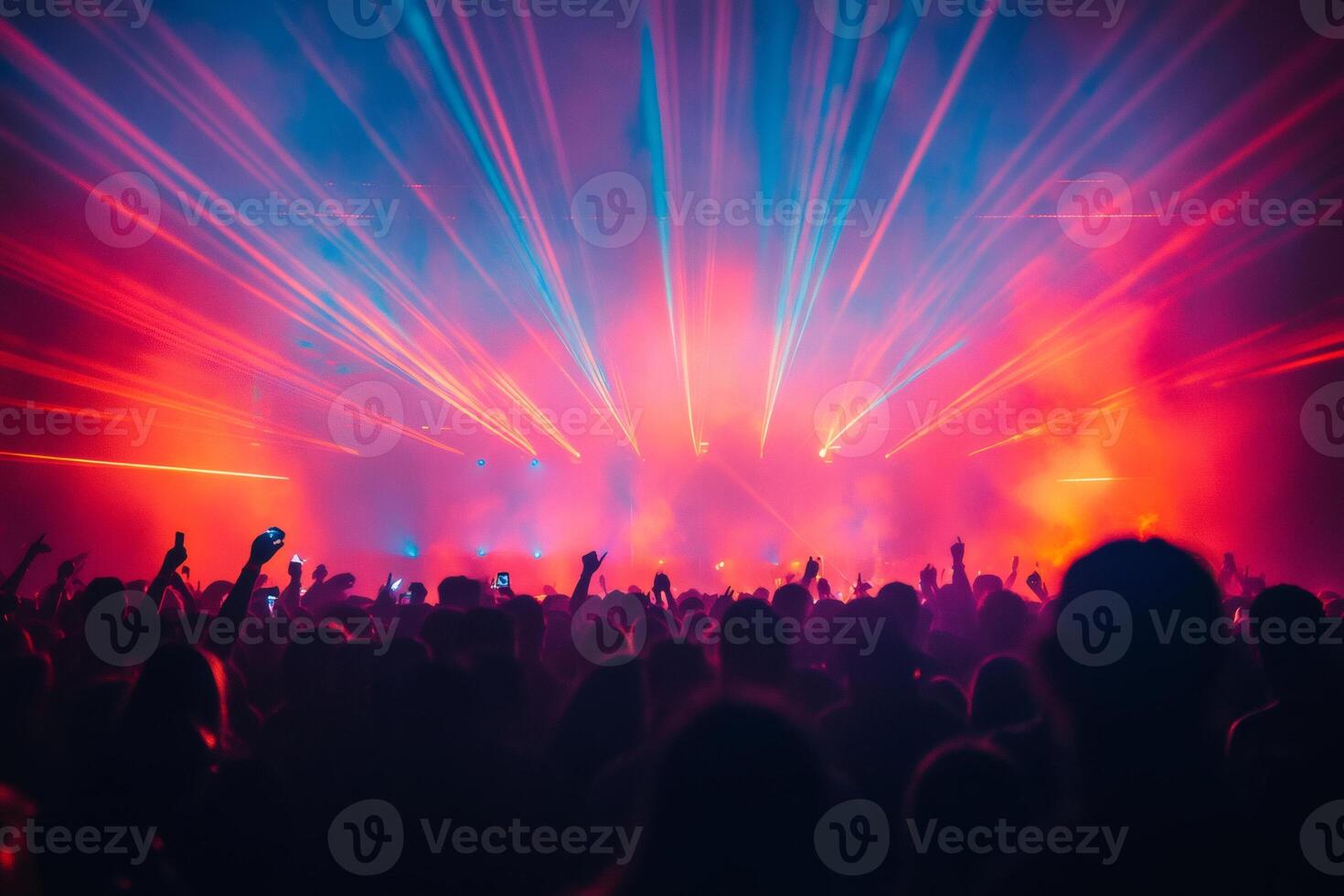 Crowd enjoying live music concert with stage lights and lasers photo