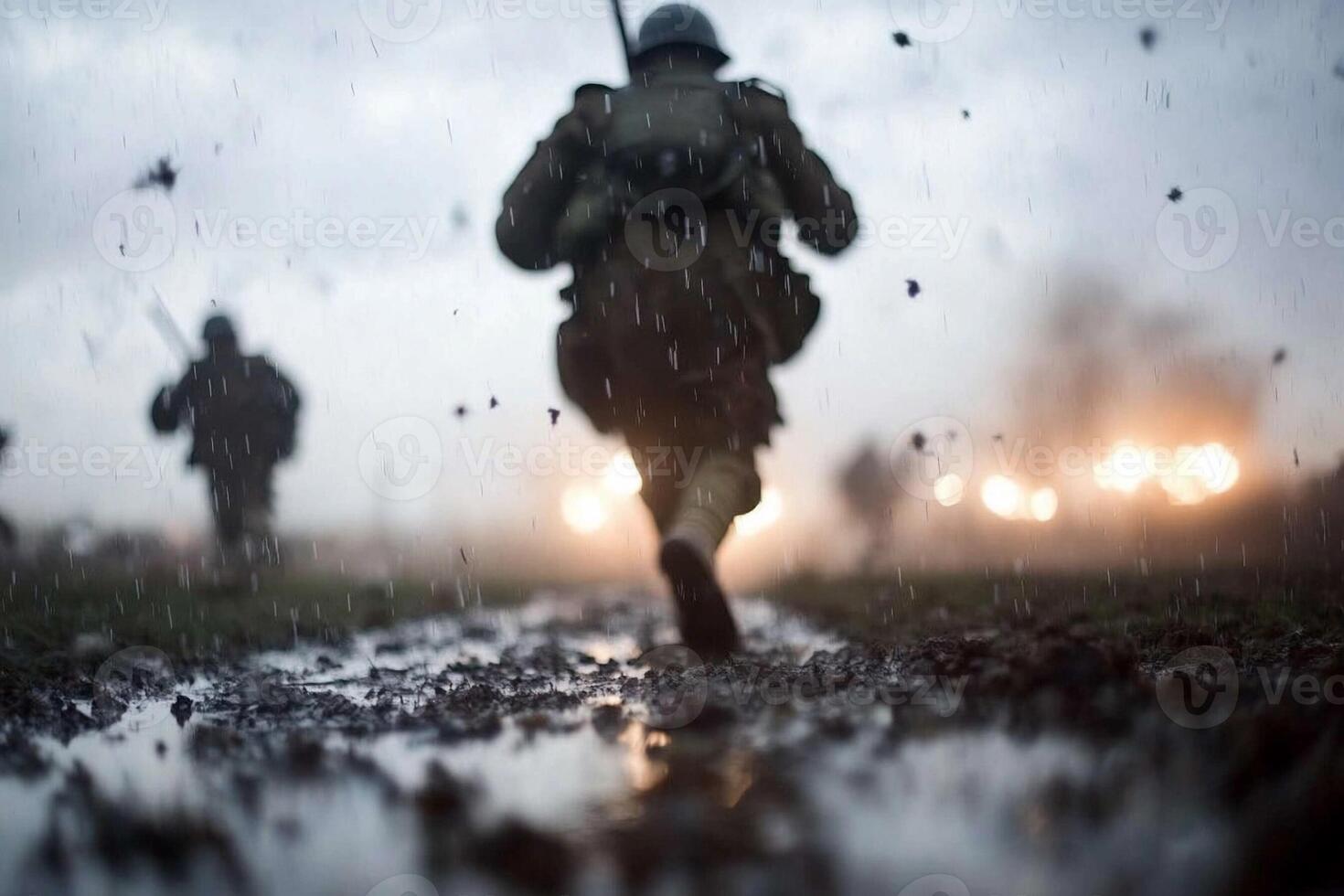 Soldiers walk through the rain in the dark photo
