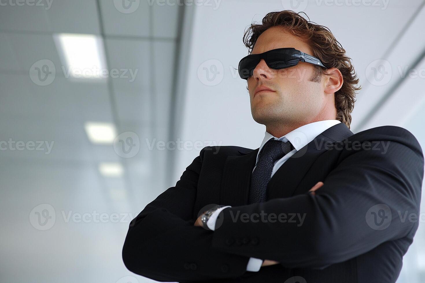 A man in a suit and sunglasses photo