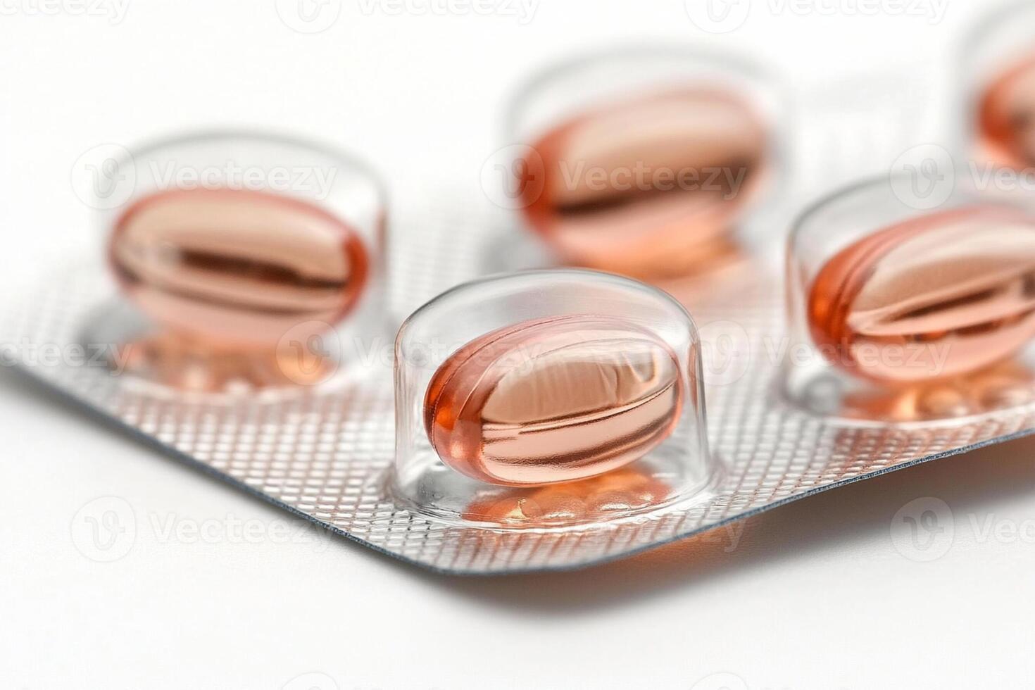 A pack of pills with orange capsules photo