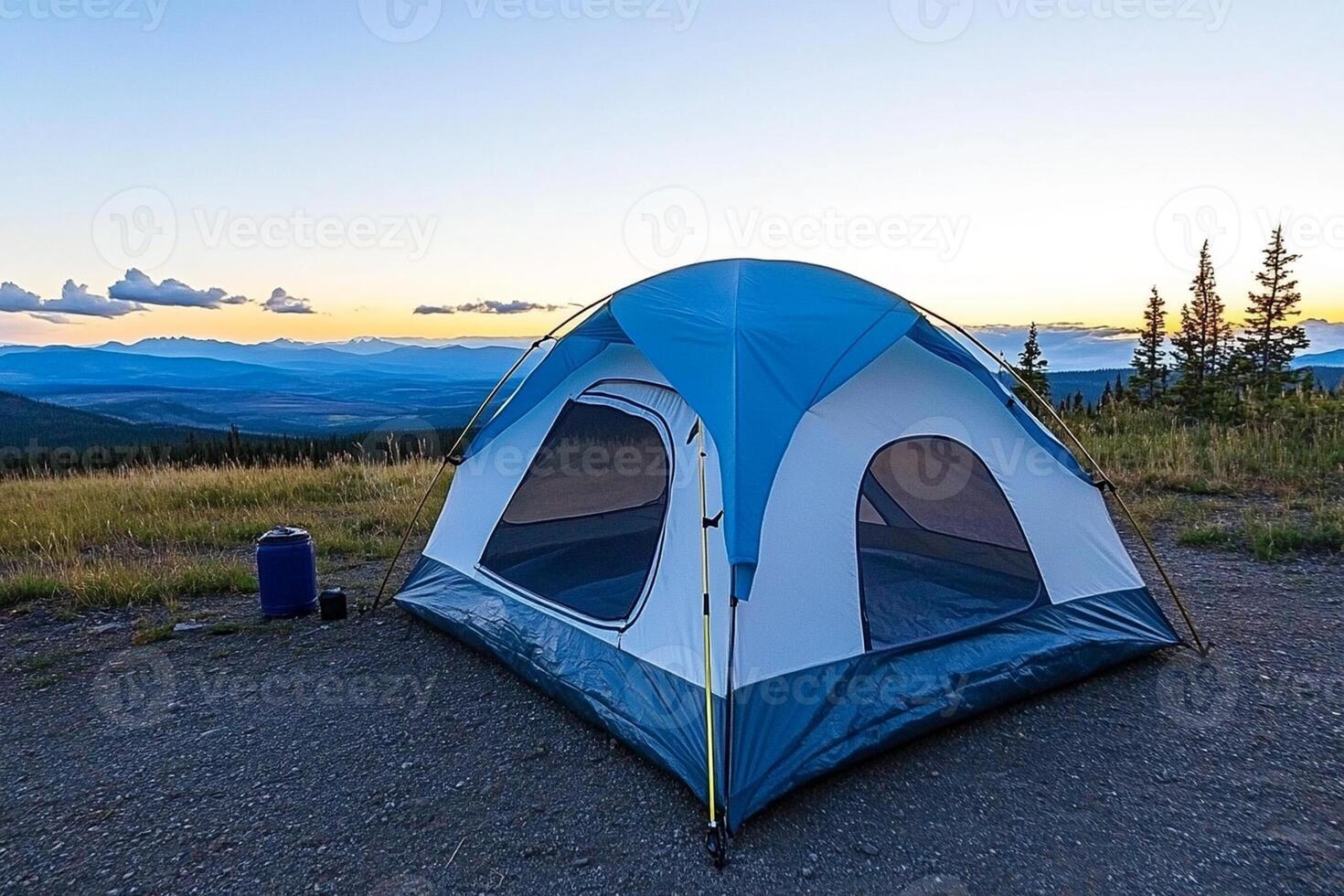 A tent is set up on a mountain top photo