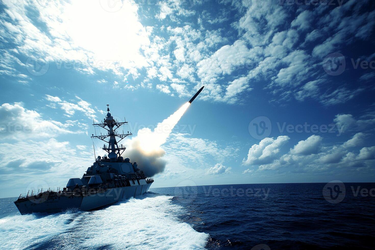 A navy ship launching a missile into the ocean photo