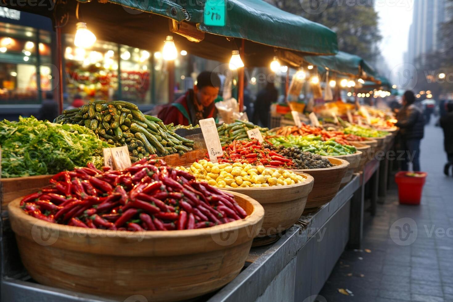 A street market with many different types of vegetables photo