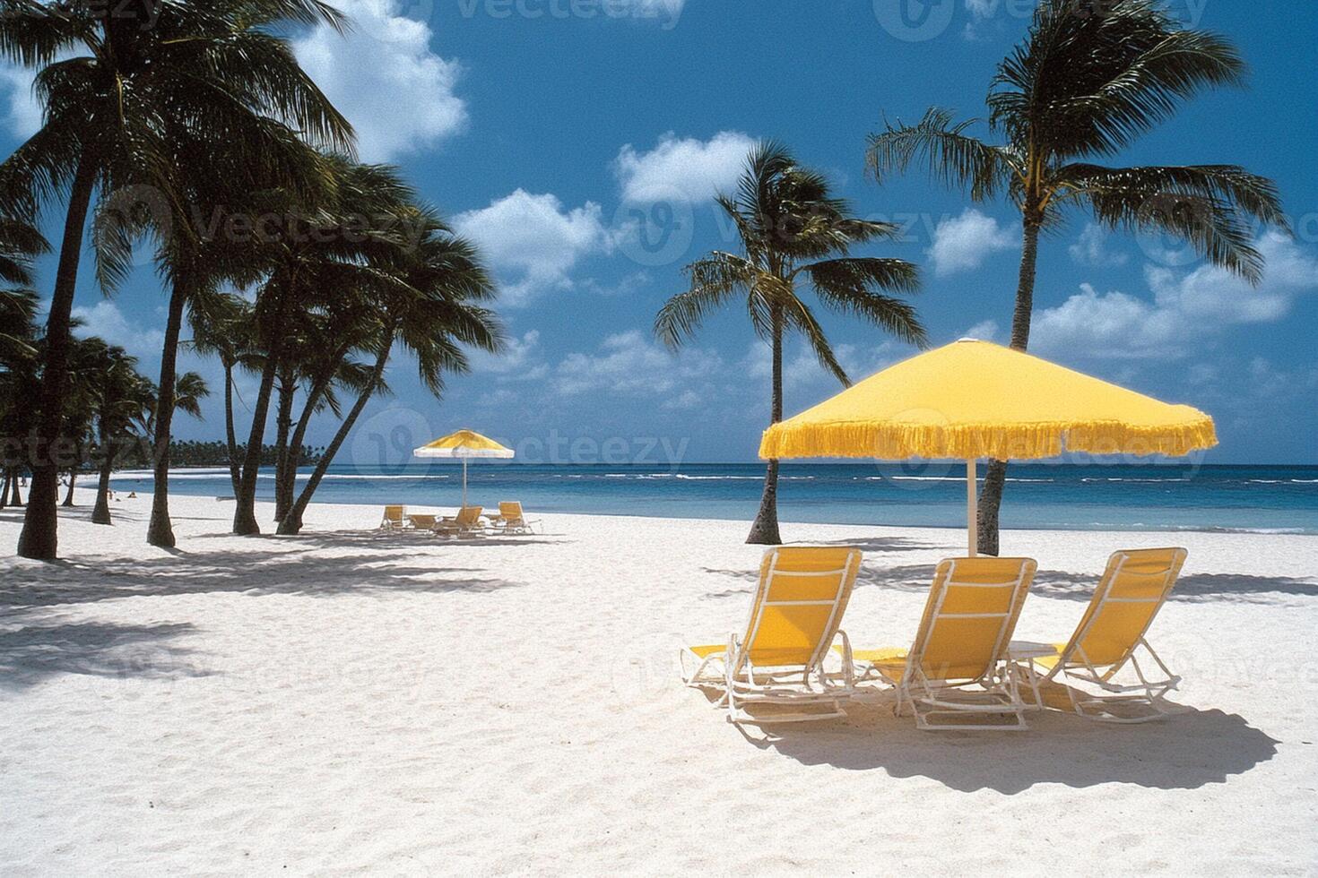 A beach with yellow umbrellas and chairs photo