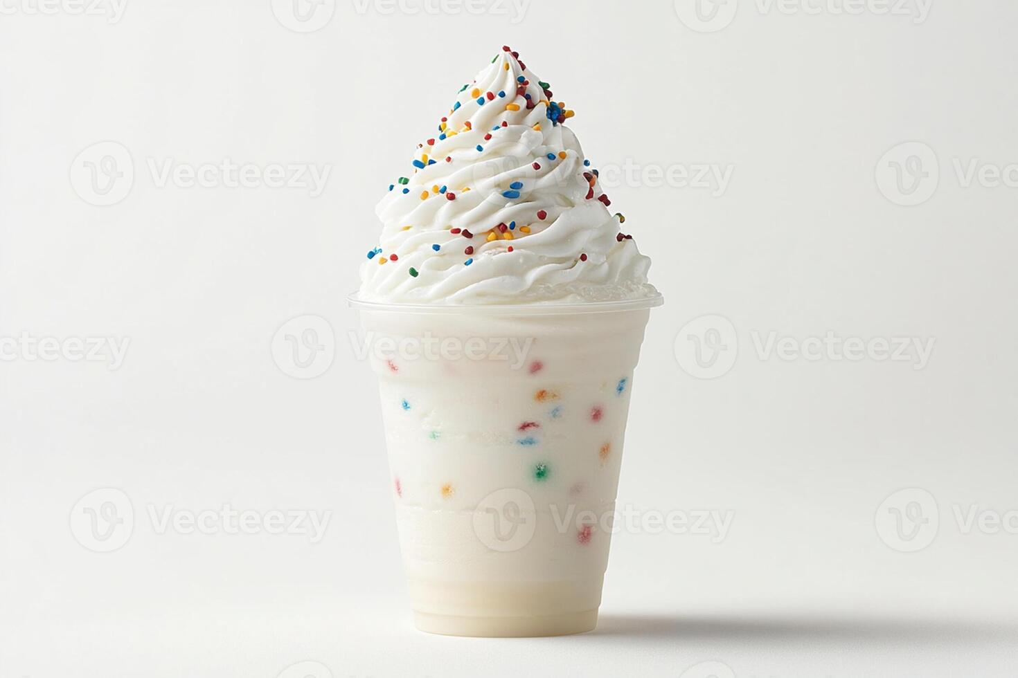 A white milkshake with sprinkles on top photo