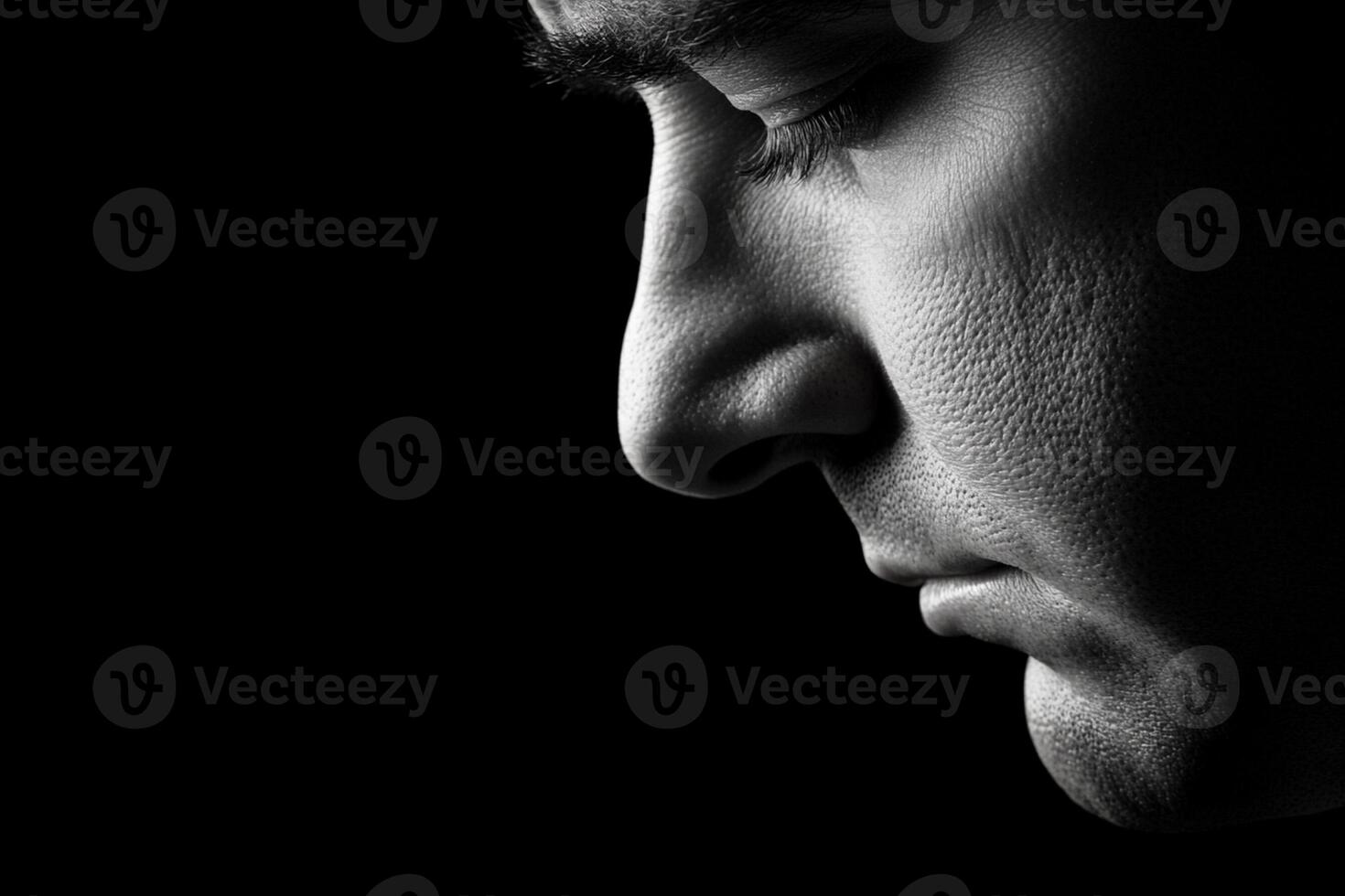 A man's face is in black and white photo